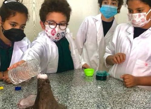 PYP 7 Y.4 being risk takers while doing their volcano eruption experiment, as a part of their inquiry into earth and its layers